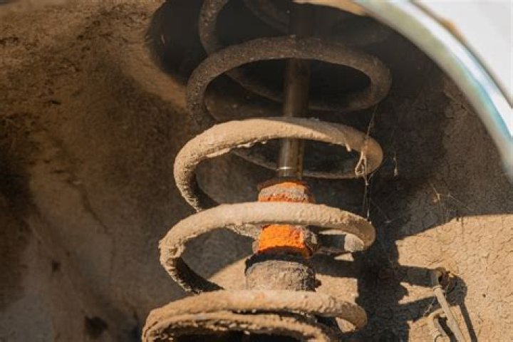 What causes a clunking noise when going over bumps?